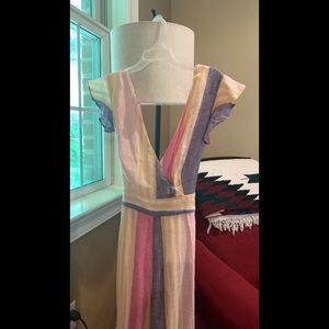 Gorgeous flutter sleeve jumpsuit. Zip up back with tie.